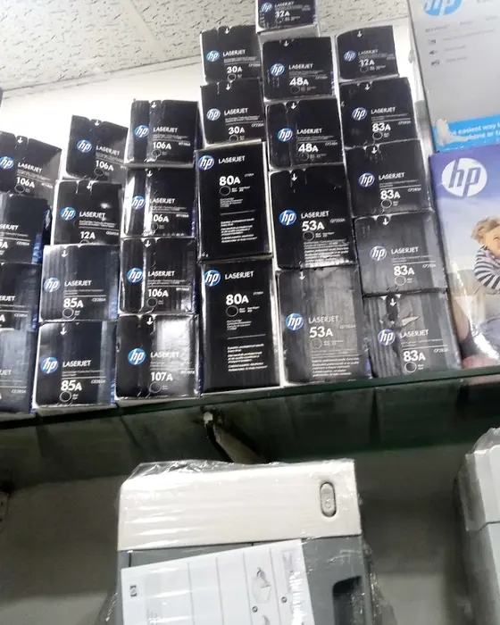Shelves of printer toner boxes and printers at the shop
