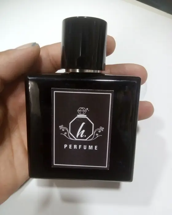 Perfume bottle with a custom printed black and white label